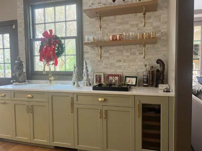 Sage green bar cabinets with brass